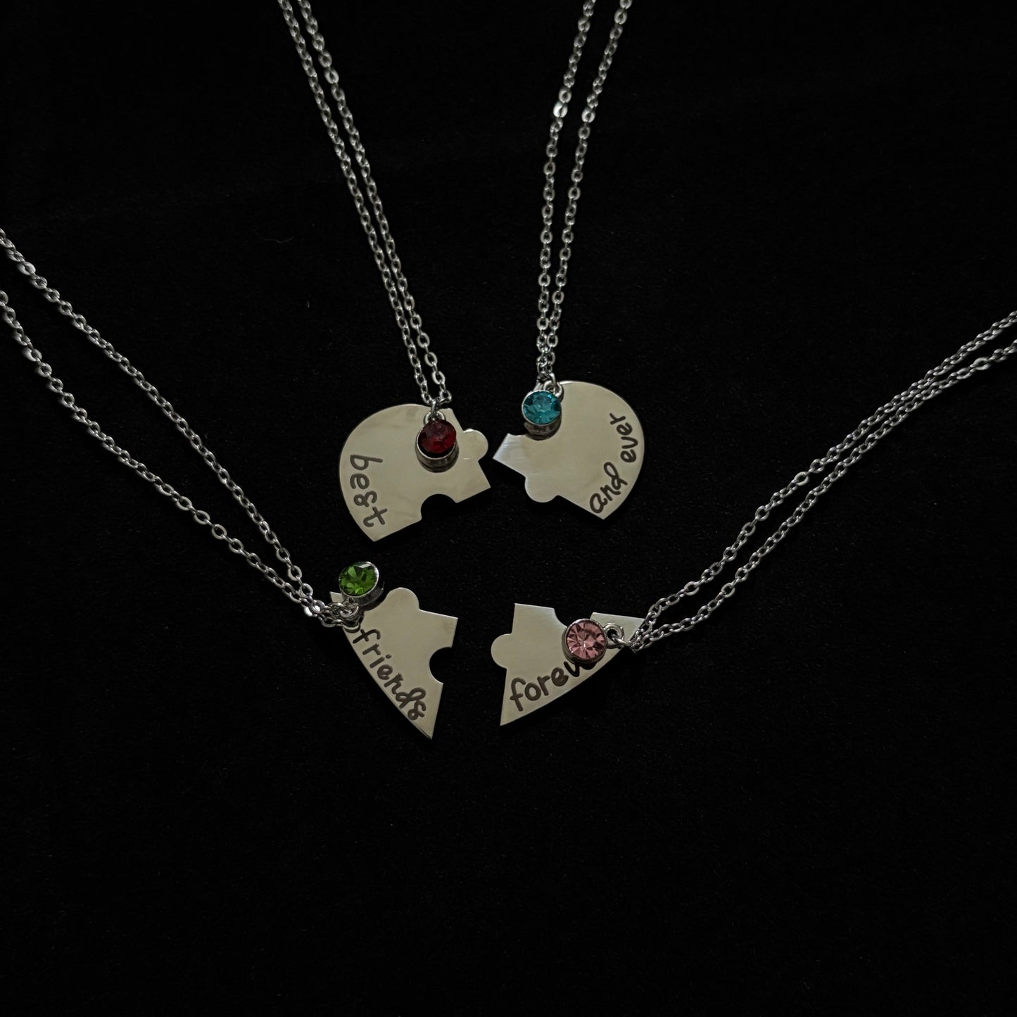 Necklace with heart-shaped pendants on a black background