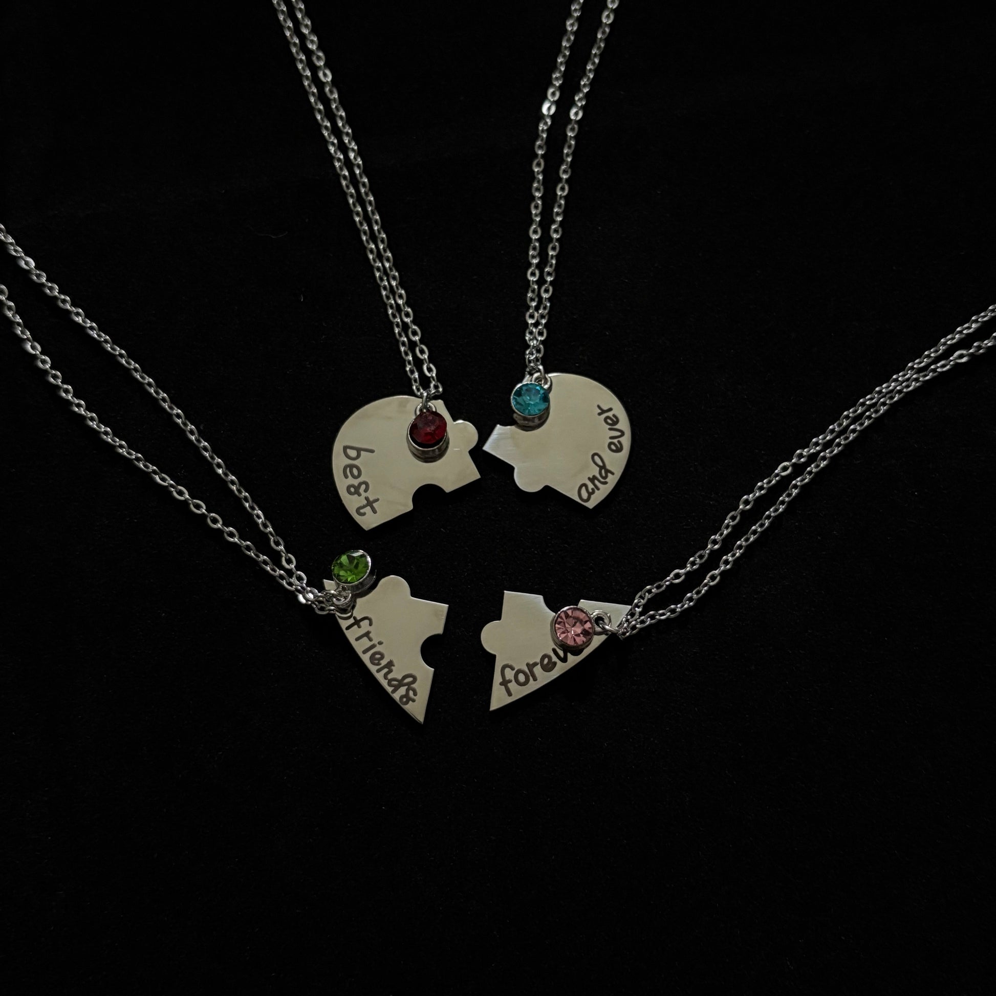 Necklace with heart-shaped pendants on a black background