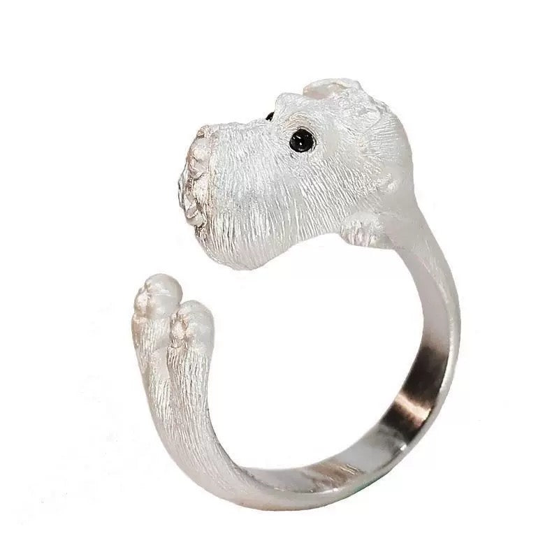 Silver dog-shaped ring on a white background