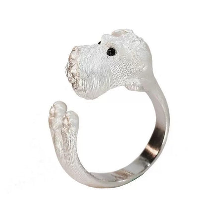Silver dog-shaped ring on a white background