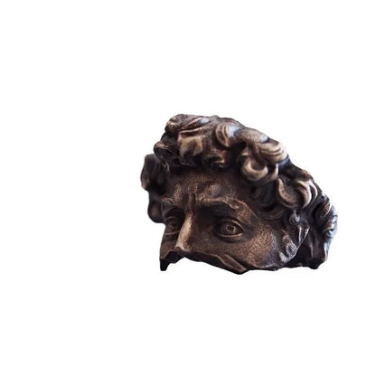 Bronze head sculpture on a white background